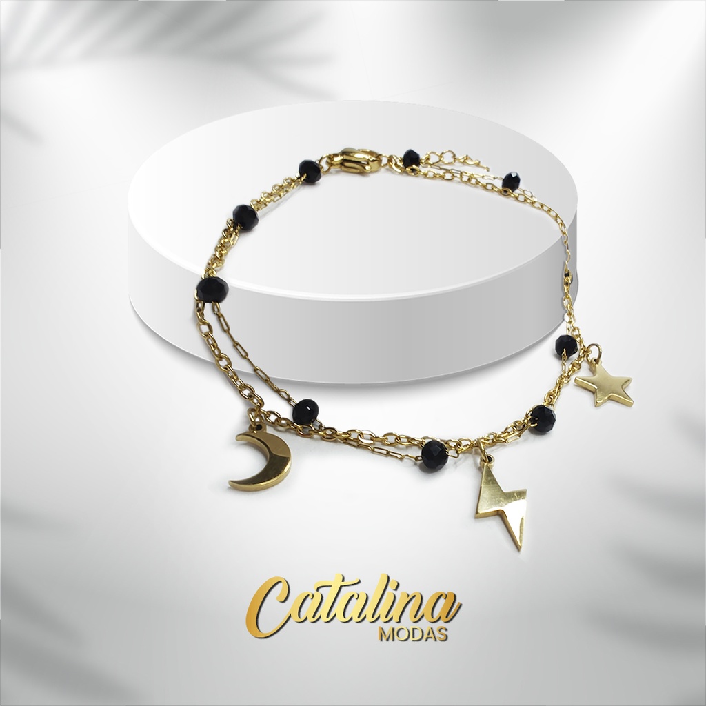 Pulsera doble con dijes. Acero dorado